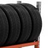 Heavy-duty tyre racking system for organised tyre storage in a warehouse., , , , Wall-mounted vertical tyre rack holding multiple car tyres in a workshop., Tyre racking shelves in a commercial garage, neatly storing various tyre sizes., Empty steel tyre rack ready for warehouse installation., Close-up view of metal tyre rack showing strong, reinforced shelving., 